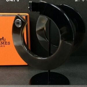 HERMES Black pierced Earrings in box. 
COA